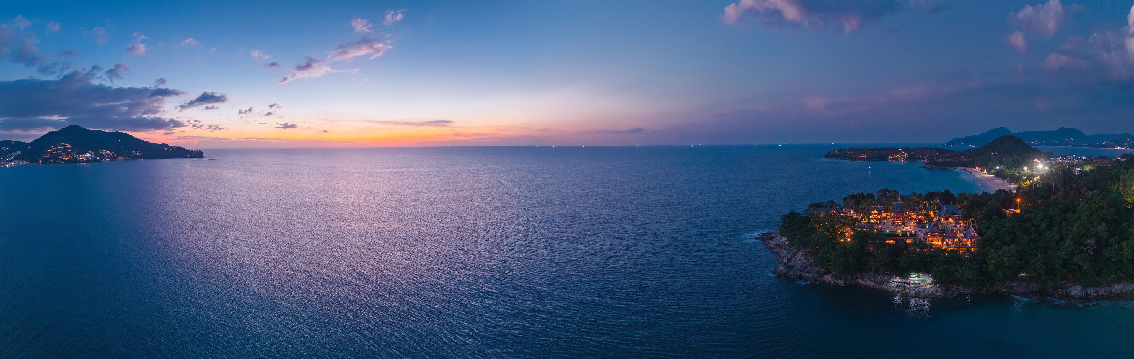 Banner Haad laem sing beach at sunset on Phuket island, Thailand - scenic coastal view