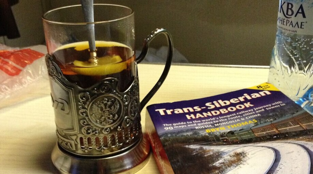 We took the Trans-Siberian train from Moscow to St Petersburg, 8 hours ride in 3rd class (platzkart) and we didn't regret it at all. We slept very well, the provodnitsa was really kind, but don't expect to find a lot of English speakers there. Body language does wonders :).
This is the cup they use for serving tea, i especially liked the metal cup holder, which was beautifully crafted. You can also buy one from the train, I think it was around 800 RUB. And it seemed only appropriate to read the Trans-Siberian Handbook on the way. Dreaming of doing the whole thing from Moscow to Vladivostok one day!