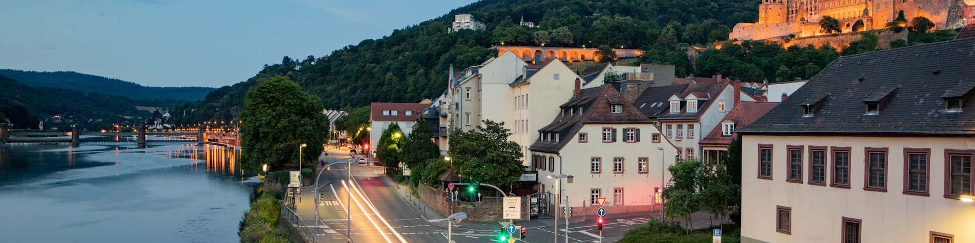 Altstadt which includes a small town or village and a river or creek