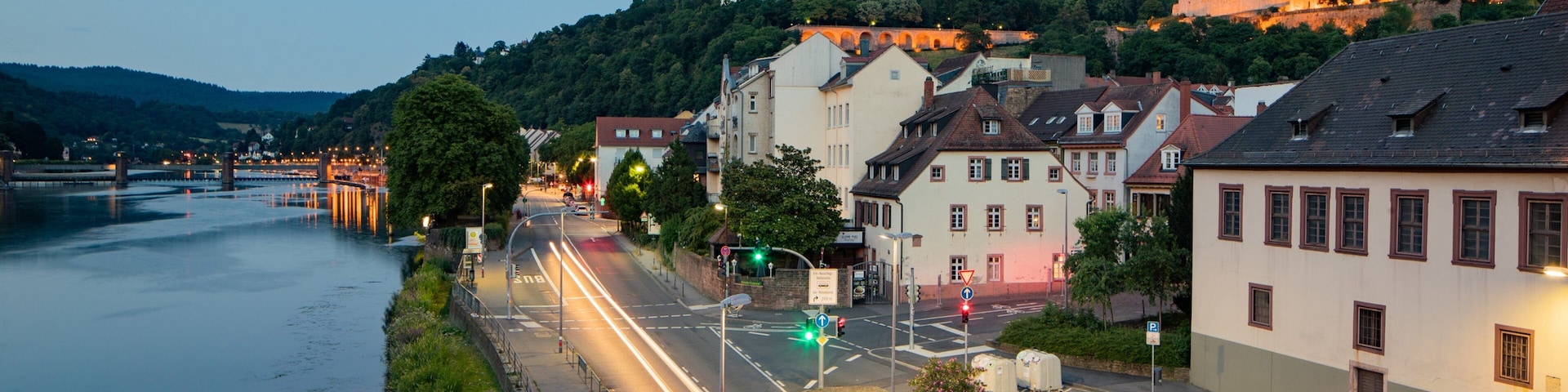 Altstadt which includes a small town or village and a river or creek