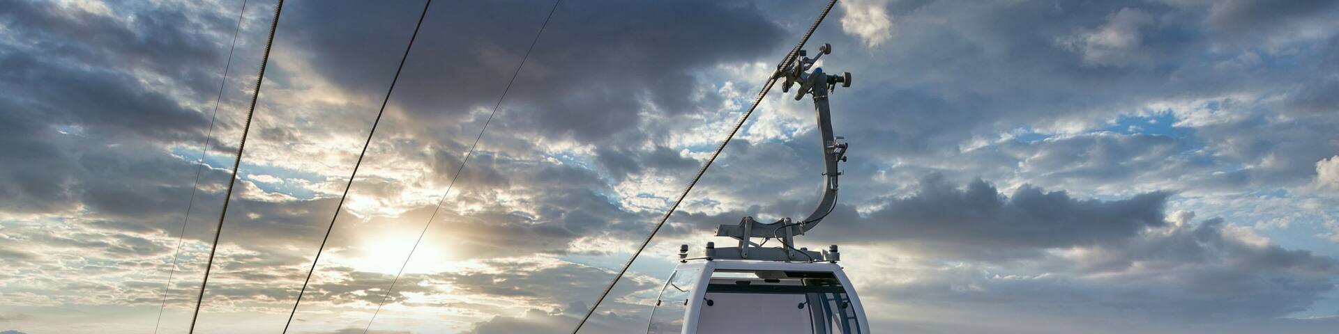 Shot of cableway. Beautiful sunset sky background