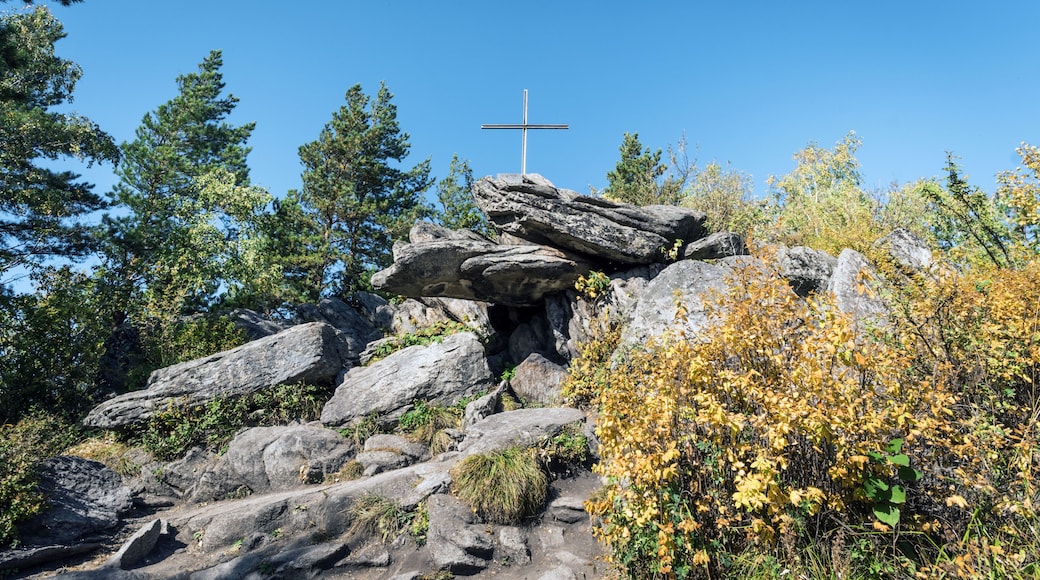 Bizarre rock with an Orthodox cross. Church mountain. Belokurikha resort Russia.