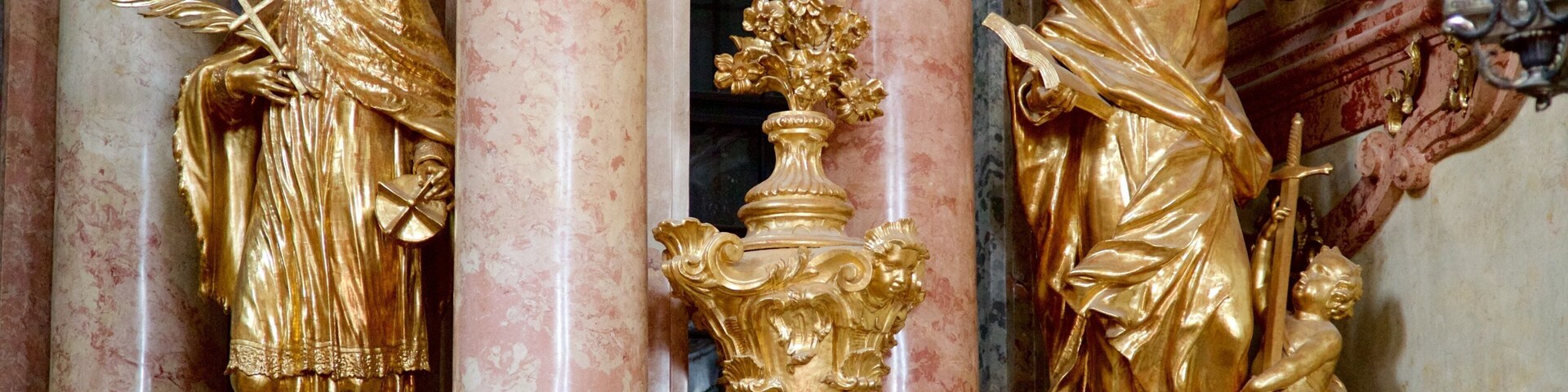 Gyor Benedictine Church featuring a church or cathedral and a statue or sculpture