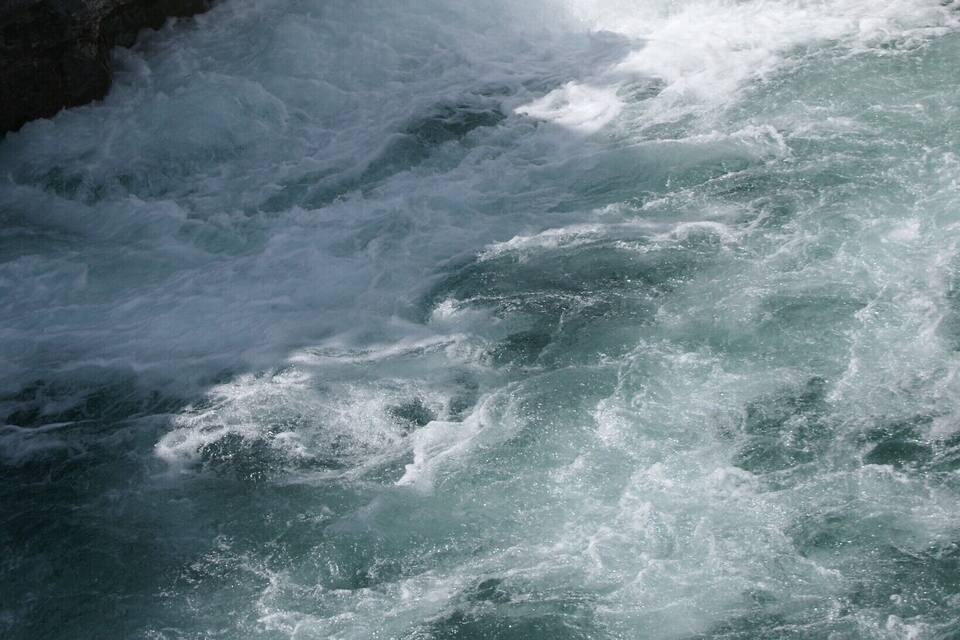 A waterfall cascading over rocky terrain.