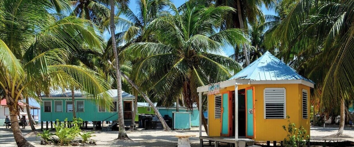 Tobacco Caye is a tiny bit of coral and sand anchored along Belize's barrier reef. The island is packed with bare-bones backpacker accommodations, and, judging by the number of beer bottles, sees lots of partying.