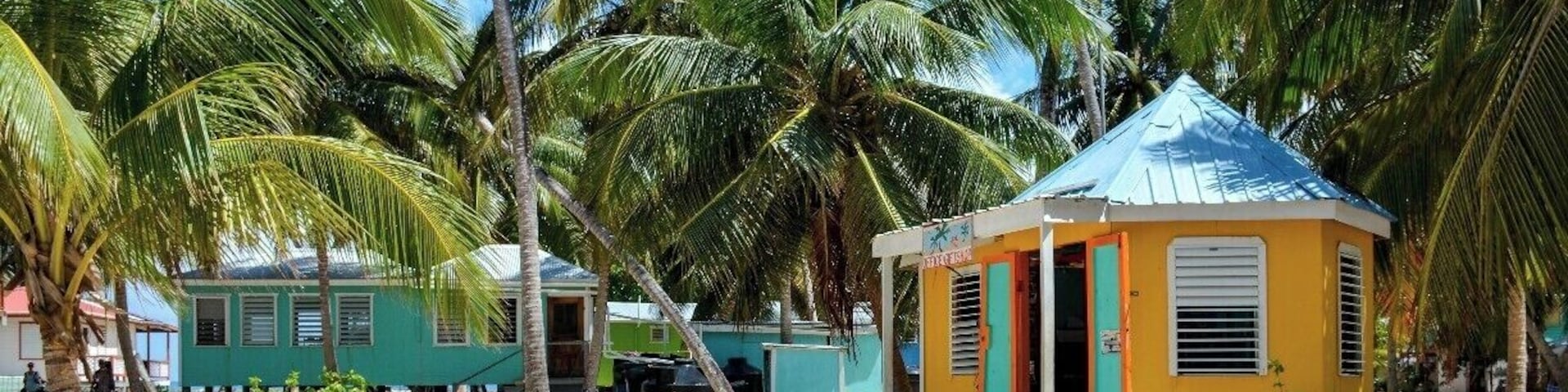 Tobacco Caye is a tiny bit of coral and sand anchored along Belize's barrier reef. The island is packed with bare-bones backpacker accommodations, and, judging by the number of beer bottles, sees lots of partying.