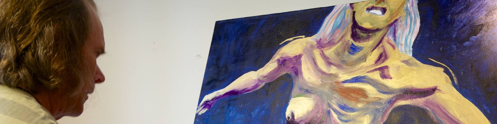 Old School House Arts Centre featuring interior views and art as well as an individual male