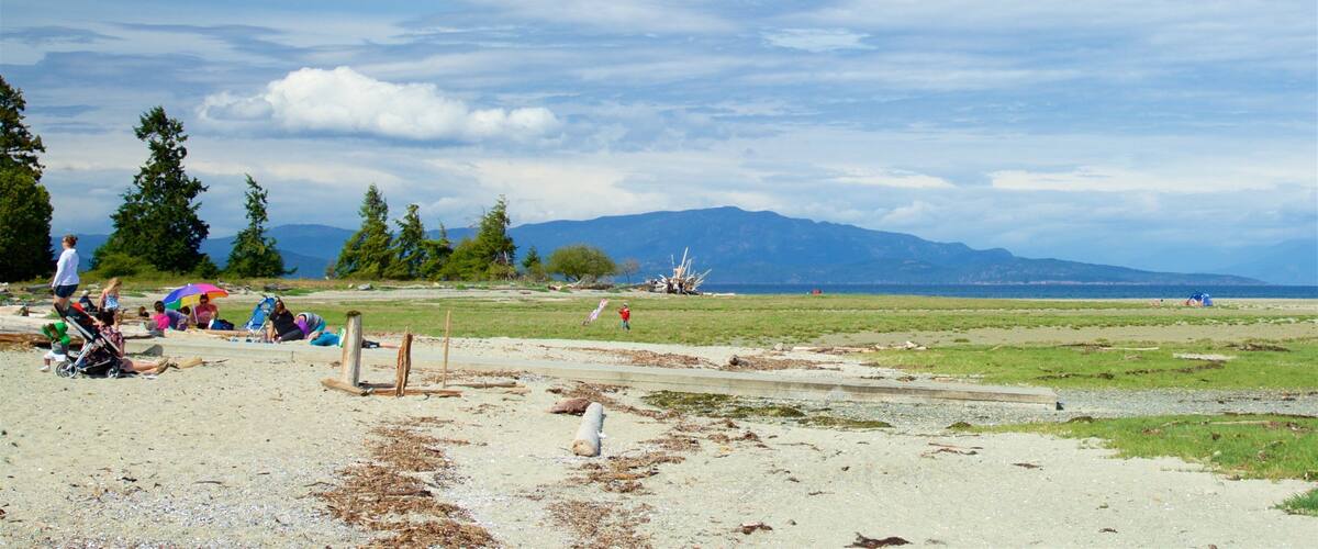 Rathtrevor Beach Provincial Park which includes tranquil scenes and landscape views as well as a small group of people