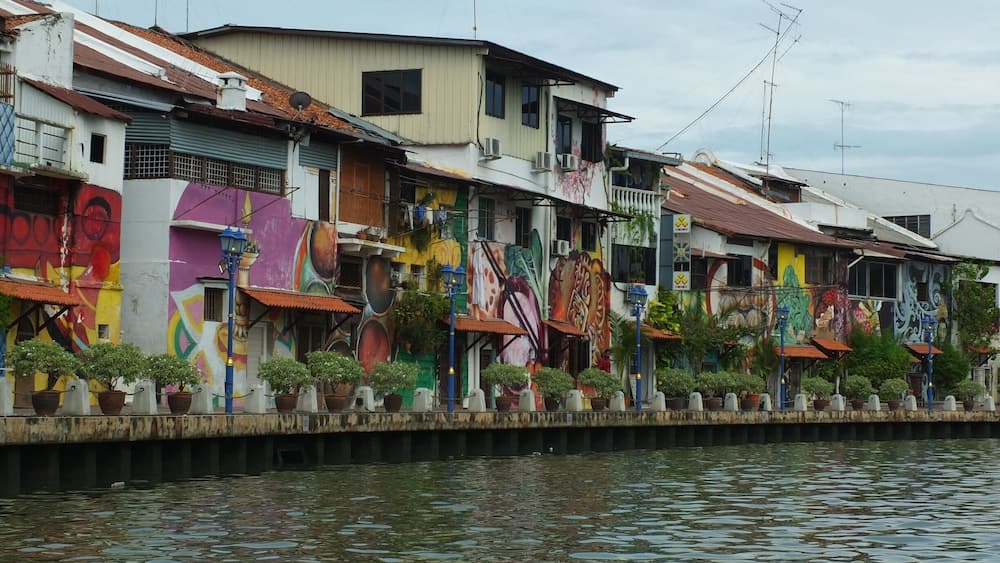 Bright graffiti walls seen from Malacca river