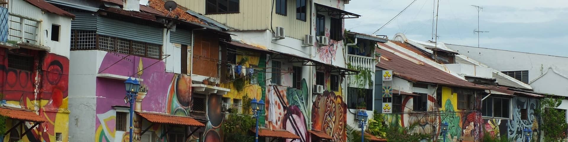 Bright graffiti walls seen from Malacca river