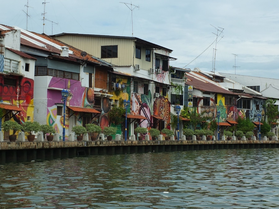 Bright graffiti walls seen from Malacca river