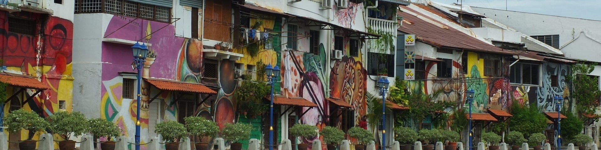 Bright graffiti walls seen from Malacca river