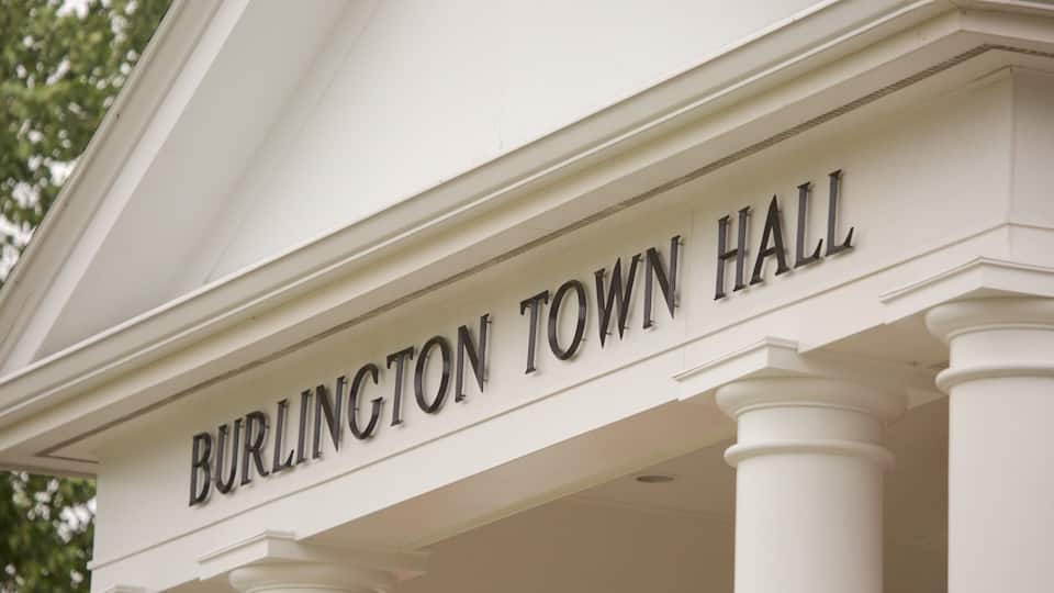 A white building with the inscription "Burlington Town Hall" on its facade.