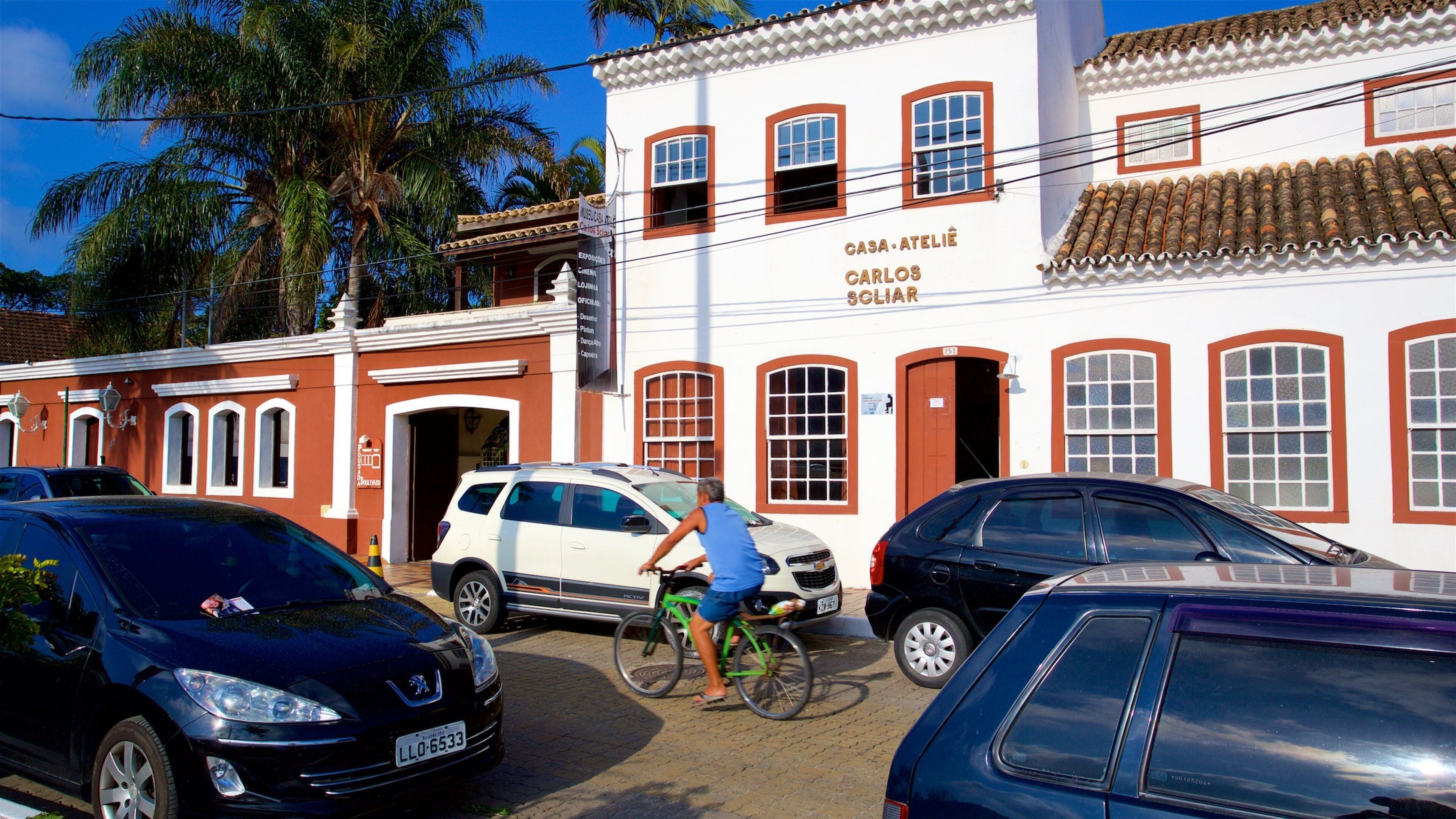 Casa-Atelie Carlos Scliar Museum featuring a small town or village and cycling as well as an individual male