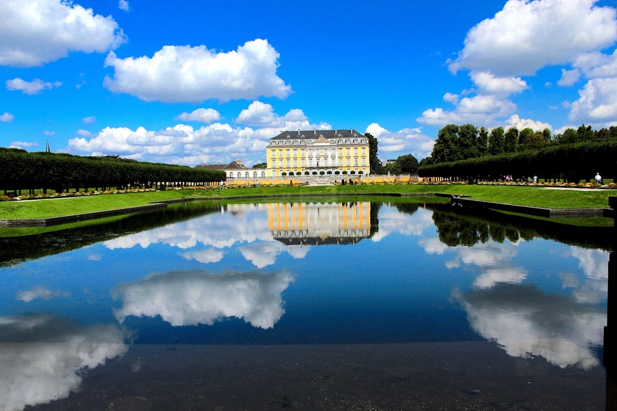 #BVSBlue
A UNESCO world heritage site in Bruhl.
Set in an idyllic garden landscape, begun by architect Johann Conrad Schlaun, and finished by François de Cuvilliés, Augustusburg Castle, the sumptuous residence of the prince-archbishops of Cologne is one of  the earliest and best examples of 18-century Rococo architecture in Germany, and directly linked to the great European architecture and art of unprecedented richness of the time. In 1725, Clemens August of Bavaria (1700-1761), Prince-Elector and archbishop of Cologne, planned and constructed this large residence at Brühl on the foundations of a medieval castle. It consists of three wings built of brick with rough-cast rendering and has two adjoining orangeries, one on the south side which includes an oratory, while the other to the north houses various service buildings.
The Castle of Augustusburg, a bold and successful revamping of the lack-lustre construction of Schlaun and the hunting lodge of Falkenlust, a dazzling creation, ex nihilio, are one of the best examples of the Rococo style, this international art of unprecedented richness.