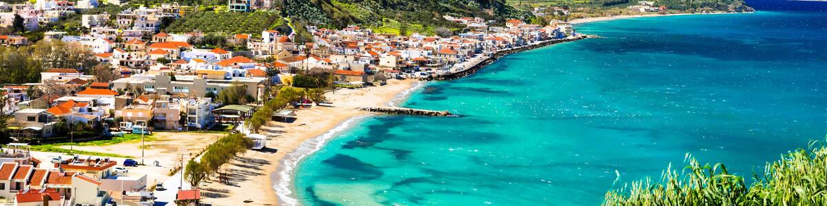 Greek summer holidays - beautiful Kalyves village with turquoise sea. Crete island, Greece travel