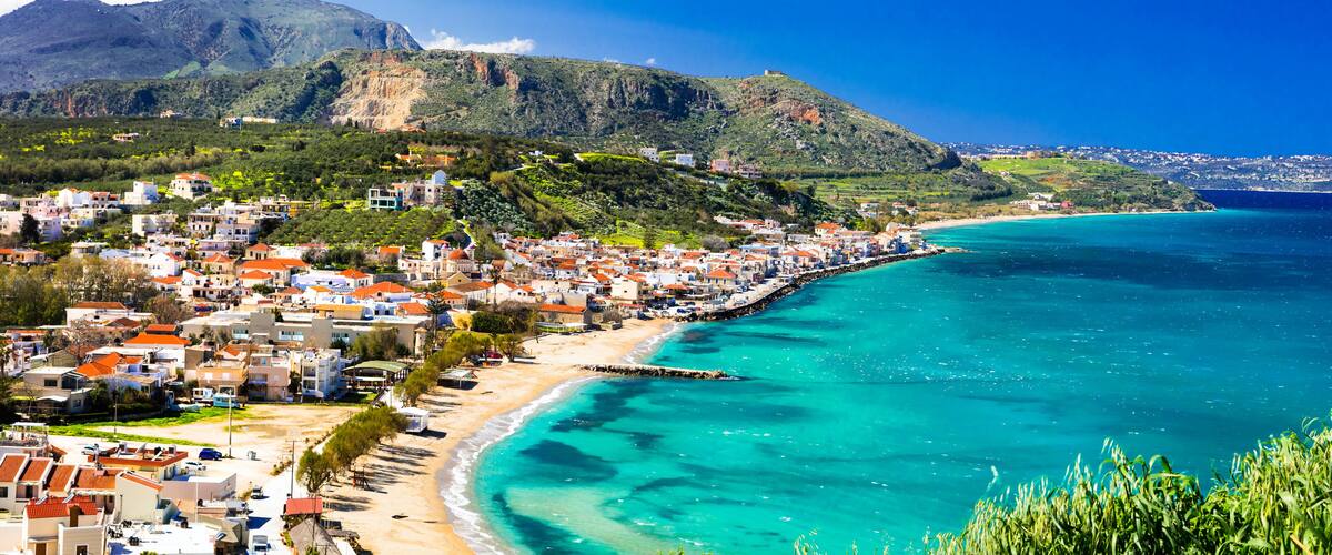 Greek summer holidays - beautiful Kalyves village with turquoise sea. Crete island, Greece travel