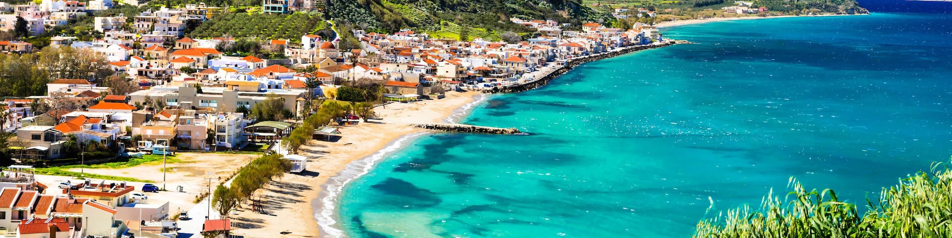 Greek summer holidays - beautiful Kalyves village with turquoise sea. Crete island, Greece travel