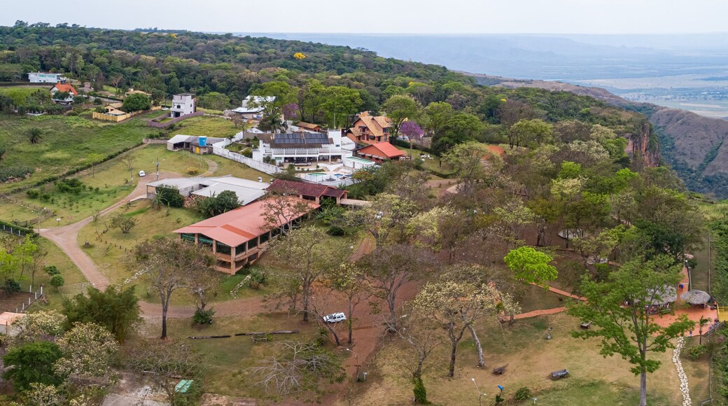 Aerial view of edge of table mountain with buildings, Chapada dos Guimarães, Mato Grosso, Brazil, South America