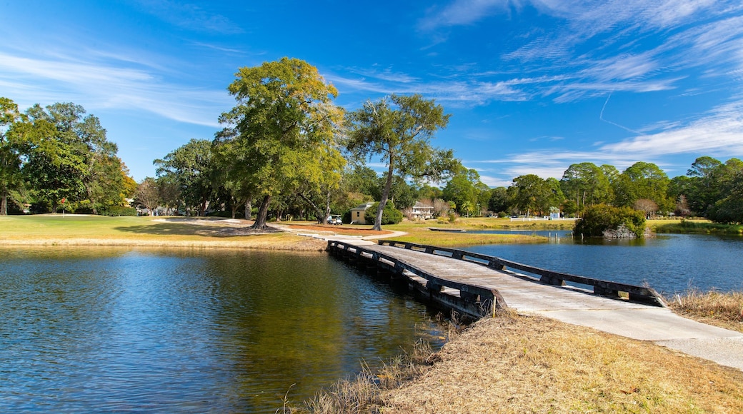 Bluewater Bay Golf Course showing a bridge and a pond