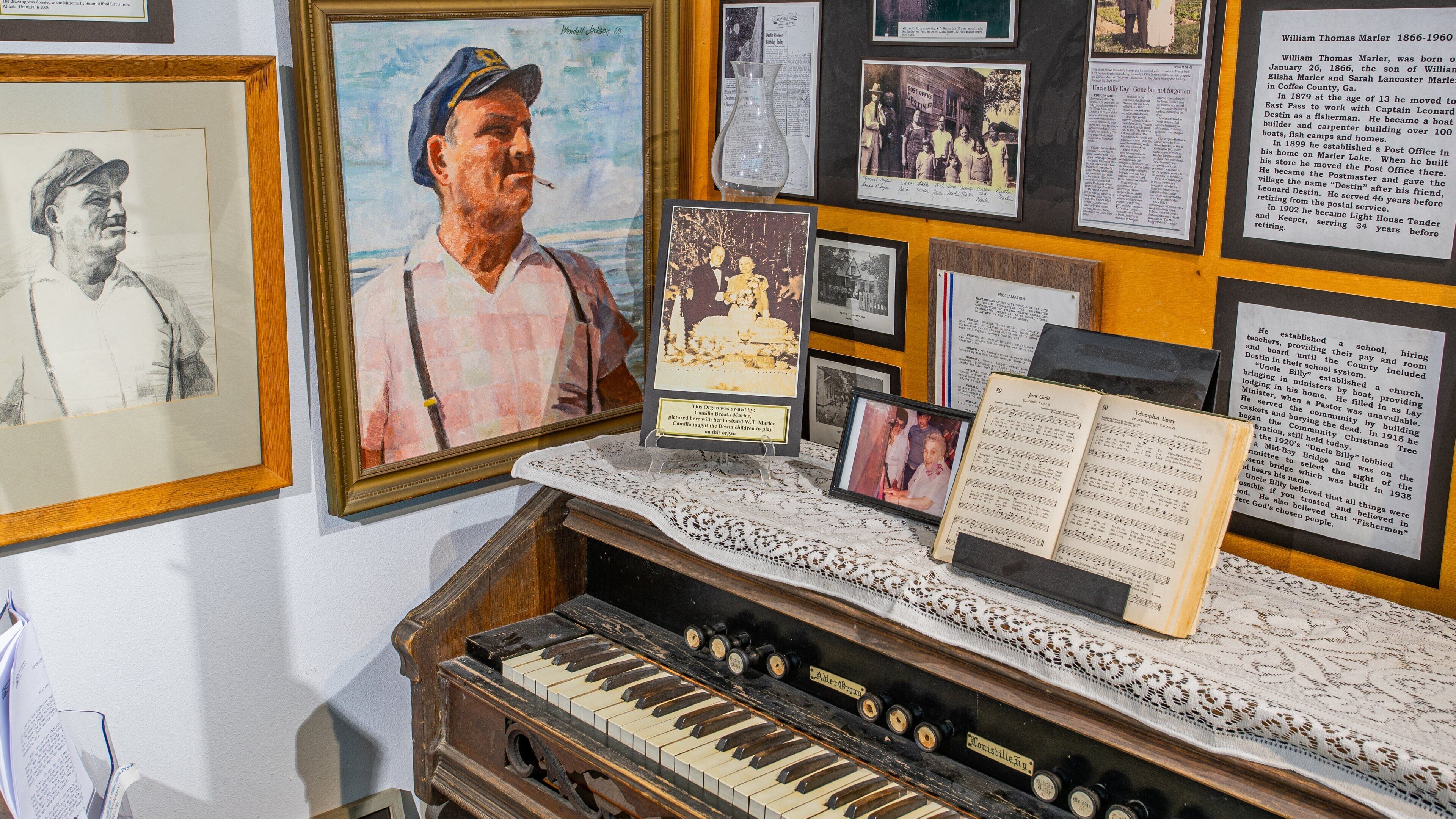 Destin History and Fishing Museum which includes signage, art and interior views
