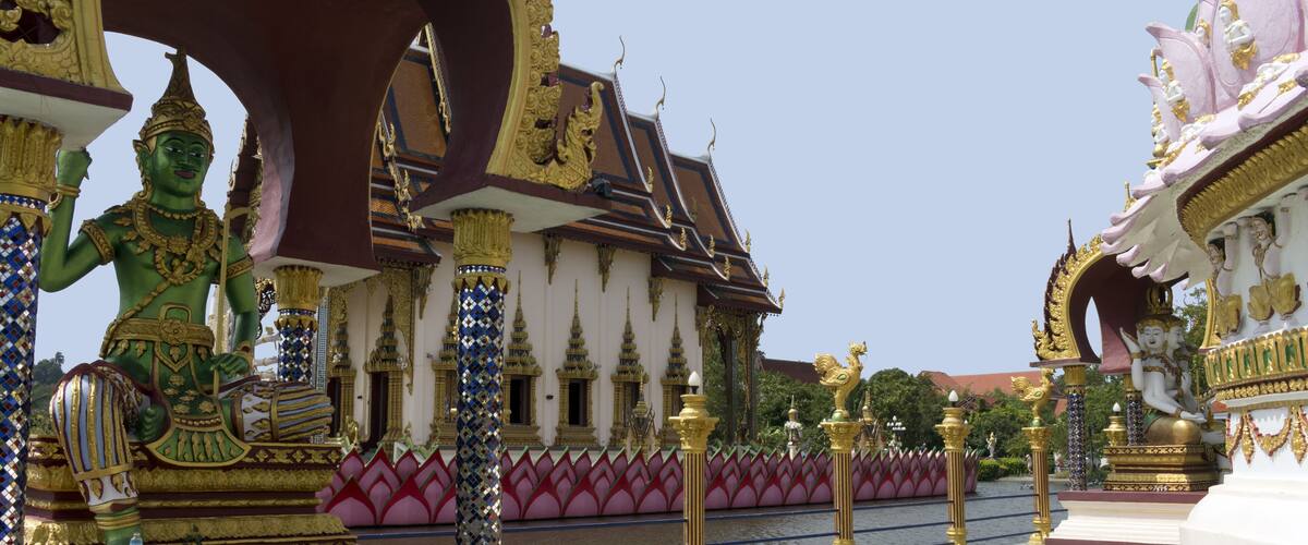 A temple with ornate golden statues and intricate architecture.