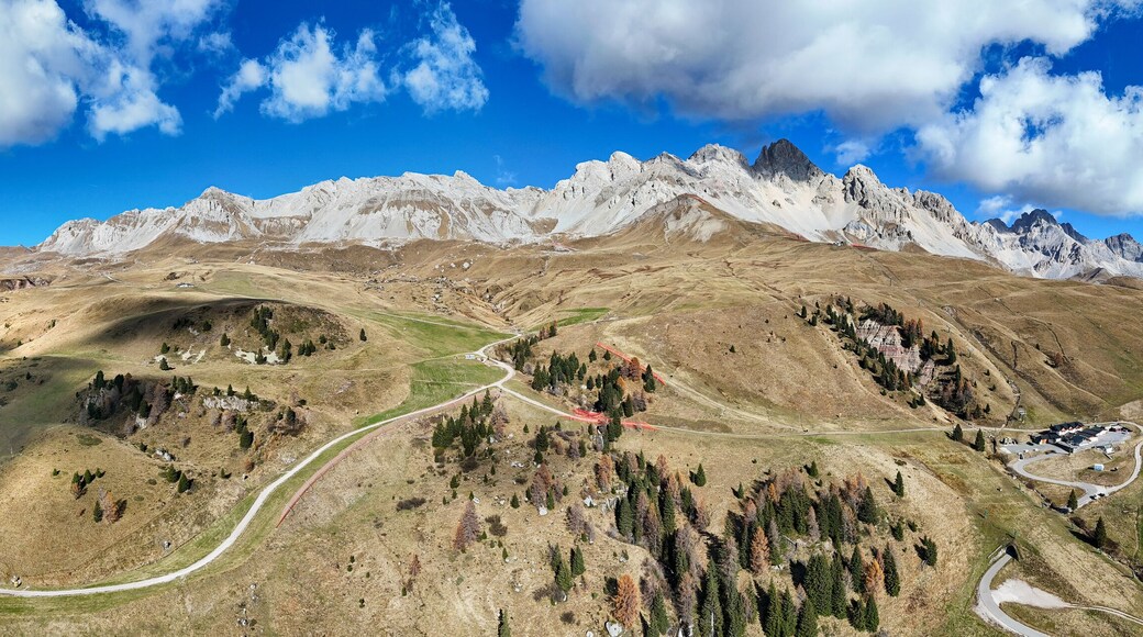 Aerial view of majestic mountain landscape with panoramic view of Dolomites and pass road, Passo San Pellegrino, Moena, Italy.