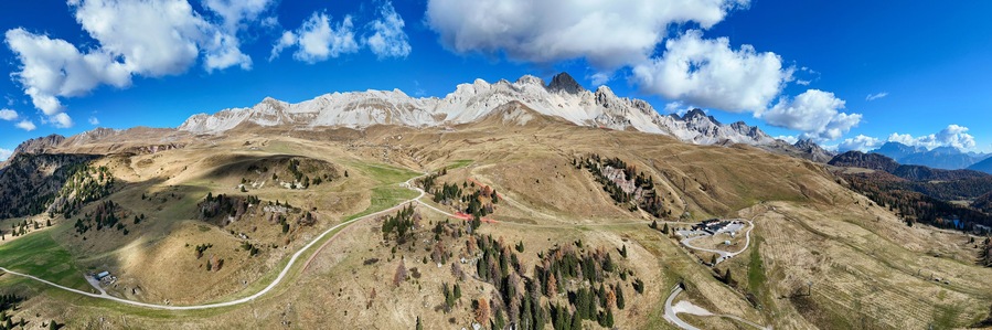 Aerial view of majestic mountain landscape with panoramic view of Dolomites and pass road, Passo San Pellegrino, Moena, Italy.
