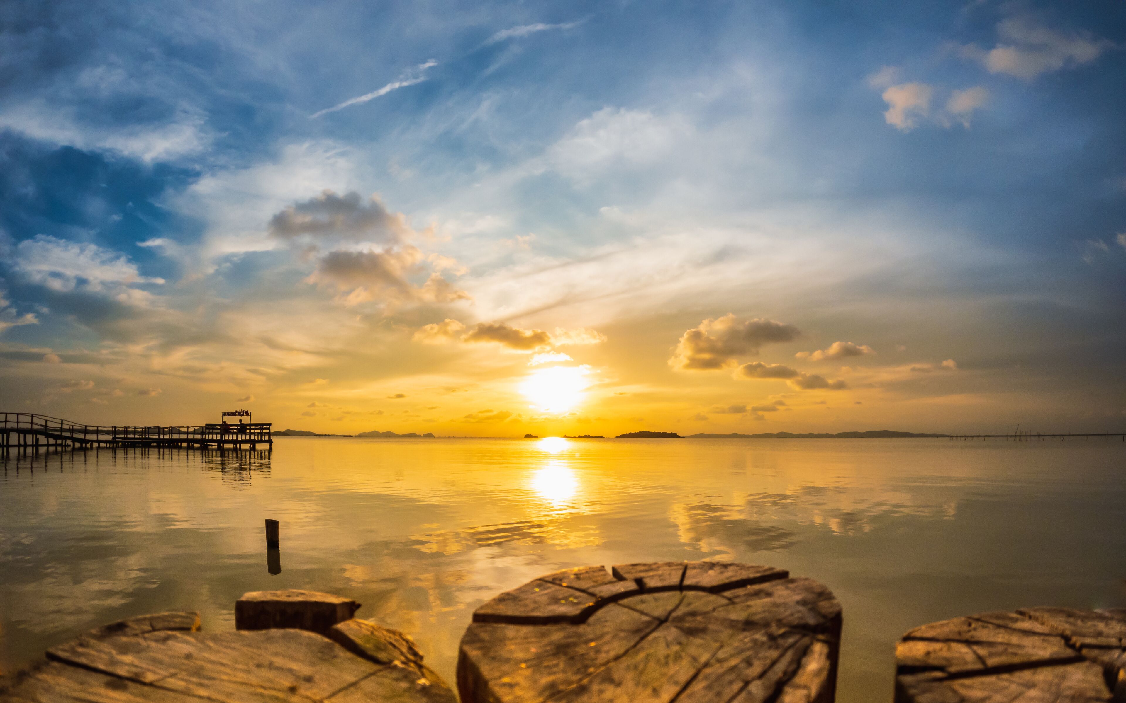 Horizon over the water. Calm songkhla lake with sunset sky and sun through the clouds over. Meditation lake and sky background at Sathing Phra, Songkhla, Thailand