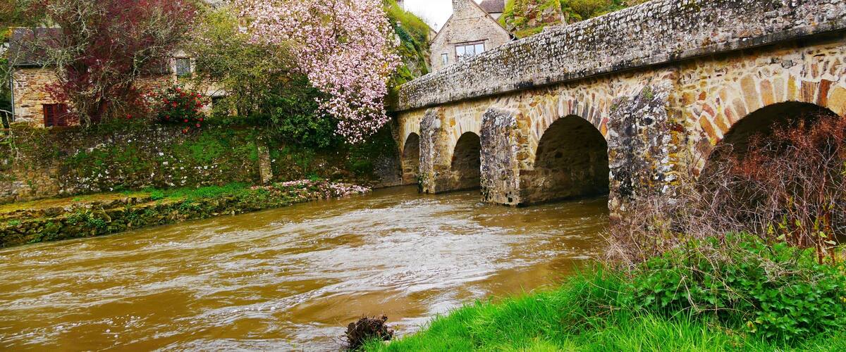Bridge over the Sarthe river at Saint-Céneri-le-Gérei in the Orne Alpes Mancelles region France Europe
