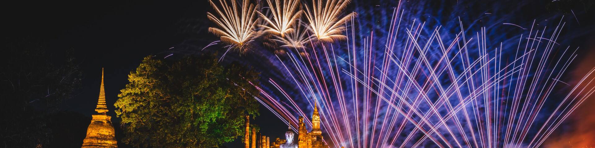 Firework at event of Loi Krathong festival showing in Sukhothai historical park, Thailand.