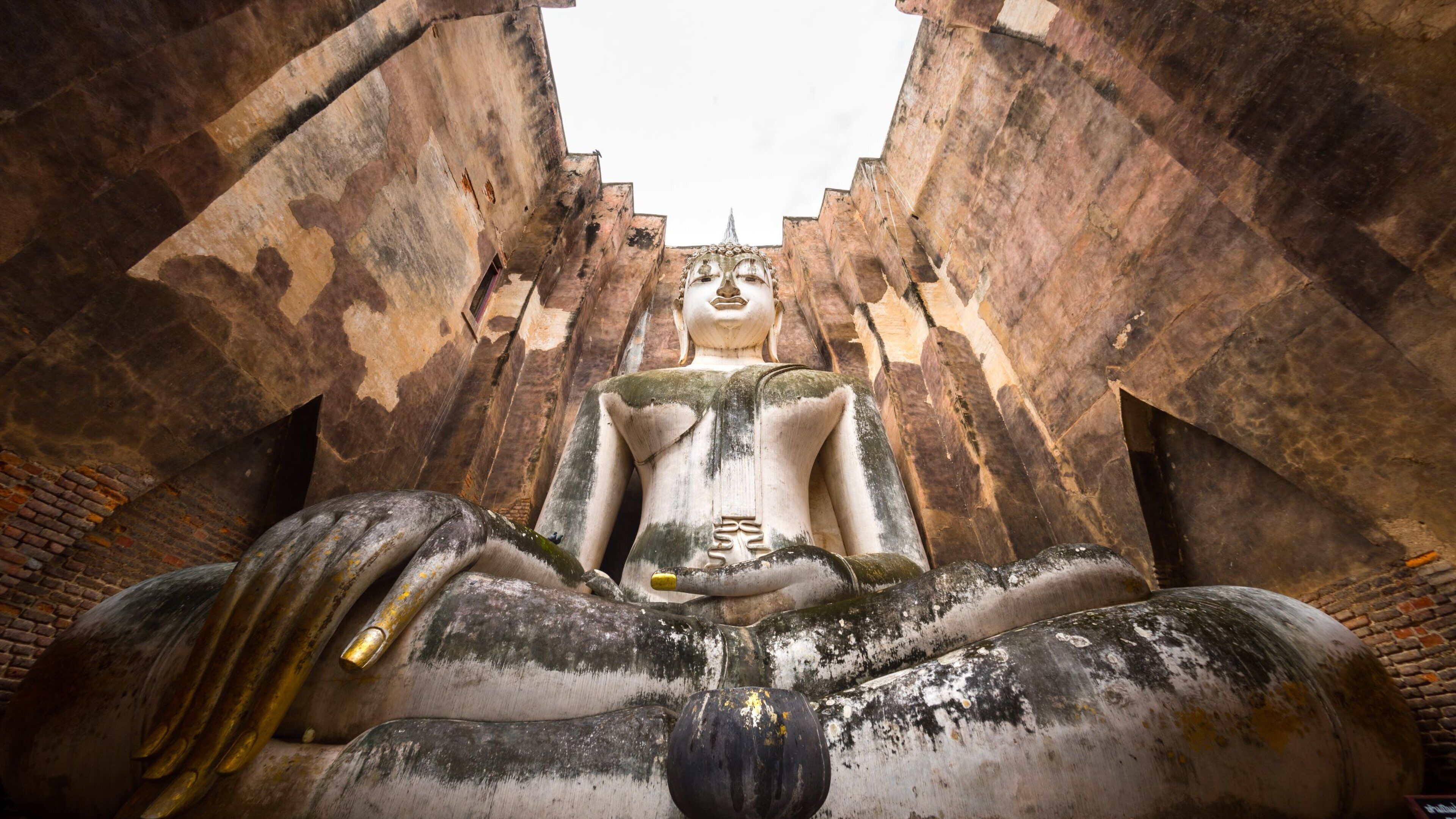 Sukhothai Historical Park featuring heritage elements and a statue or sculpture