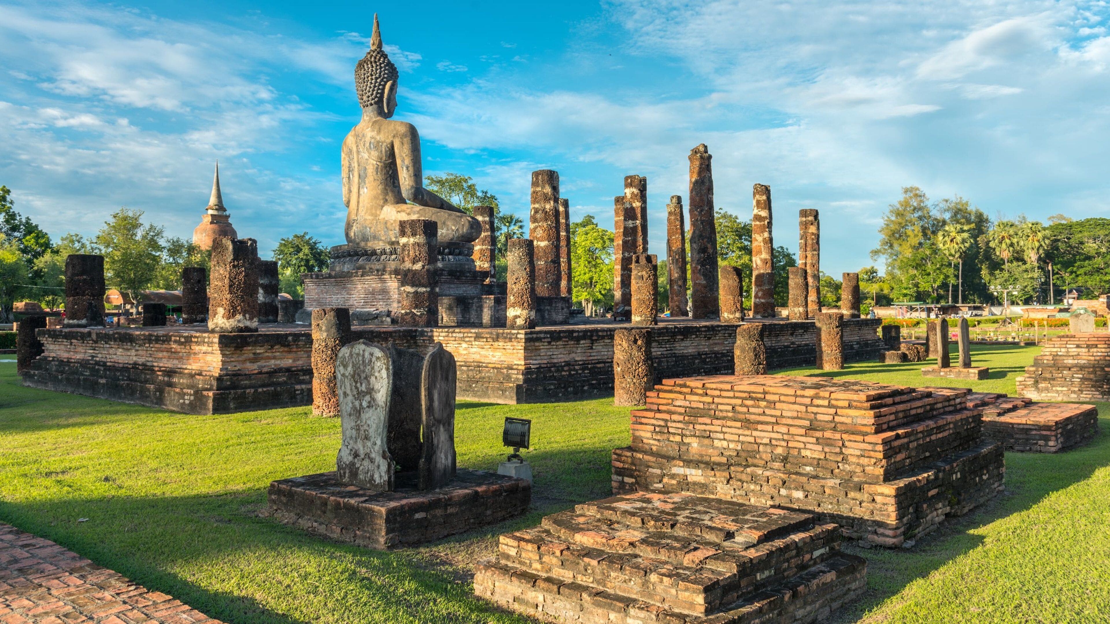 Sukhothai Historical Park featuring heritage elements, a garden and a statue or sculpture