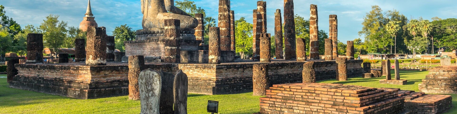 Sukhothai Historical Park featuring heritage elements, a garden and a statue or sculpture
