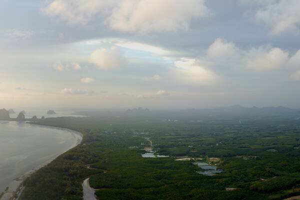 An unspoilt beach of Pak meng, Sikao District, Trang Province, Thailand. A natural beauty of crystal clear sea water, white sandy beach and distant islands located at Southern Thailand