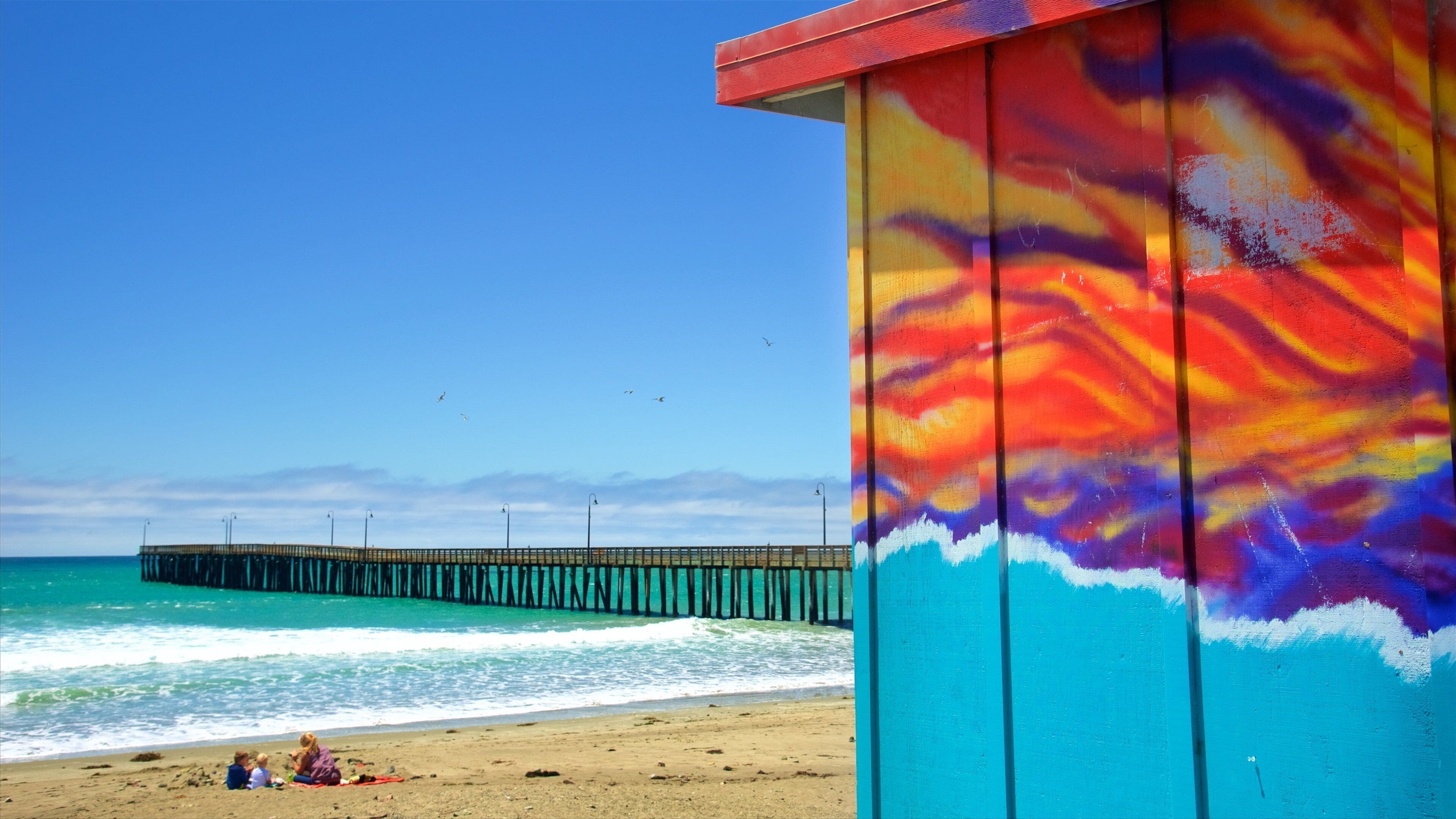 Cayucos State Beach which includes a sandy beach, general coastal views and outdoor art
