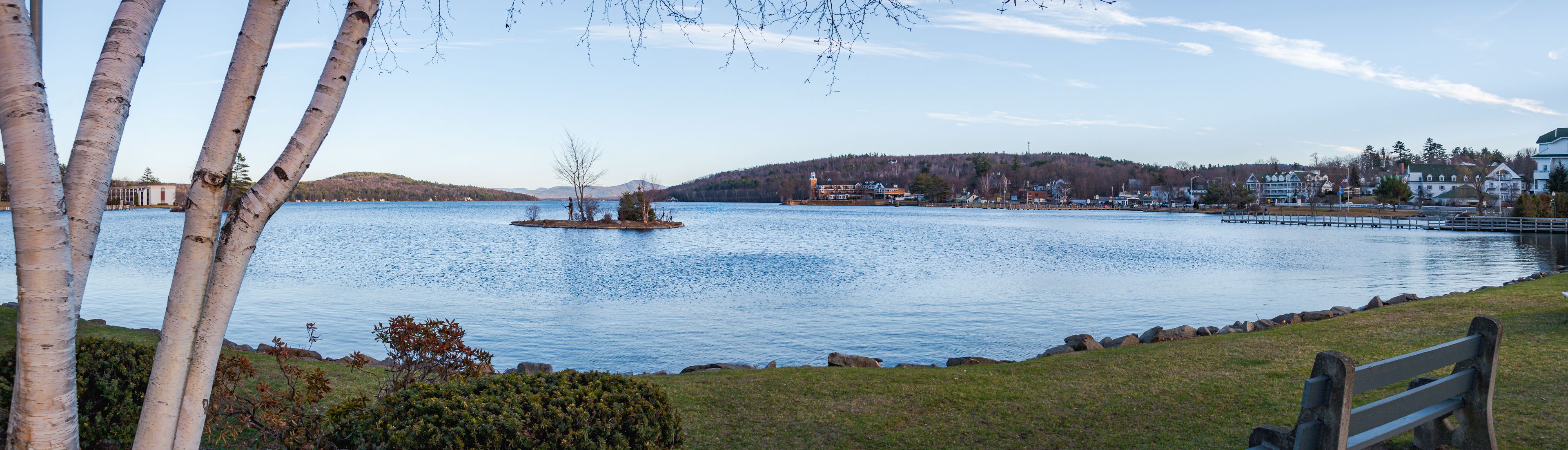 Late afternoon view of Lake Winnipesaukee and Meredith, New Hampshire, on a clear, crisp blue sky day.