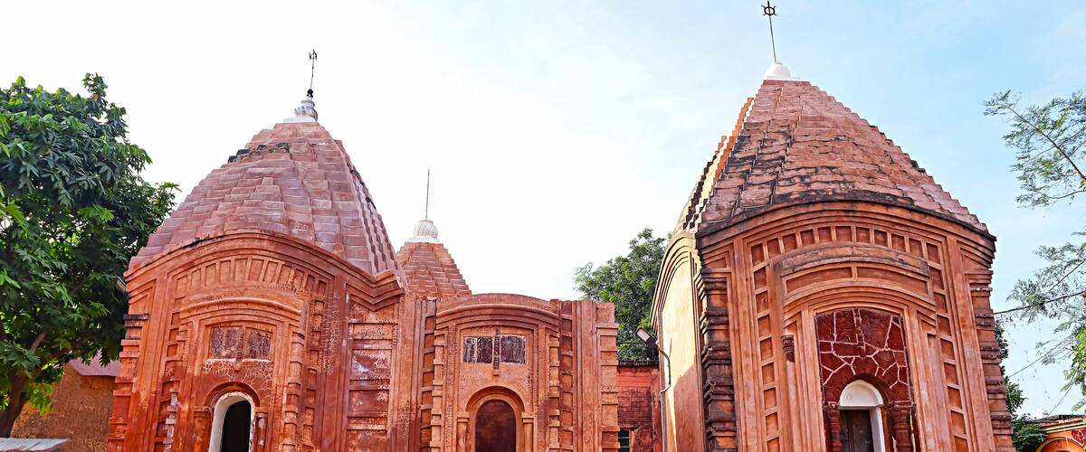 A temple with multiple domes and intricate carvings.