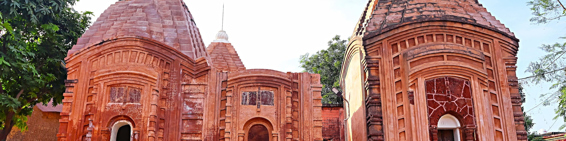 A temple with multiple domes and intricate carvings.