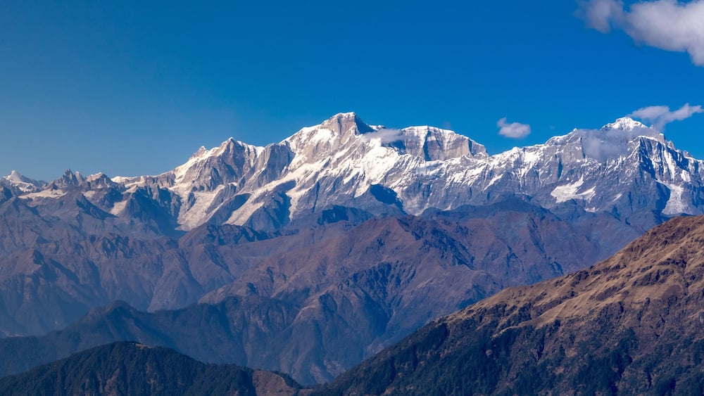 Panoramic view Himalayan mountains view from Chandrashila summit, Chopta. Chandrashila is a peak in the Himalayan ranges in Uttarakhand state of India. It lies at an altitude of 12,083 ft from the sea