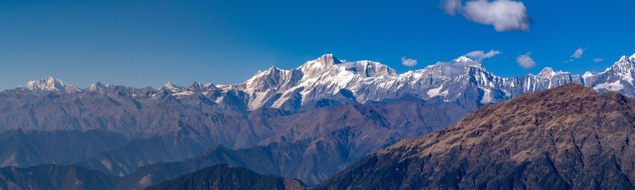 Panoramic view Himalayan mountains view from Chandrashila summit, Chopta. Chandrashila is a peak in the Himalayan ranges in Uttarakhand state of India. It lies at an altitude of 12,083 ft from the sea