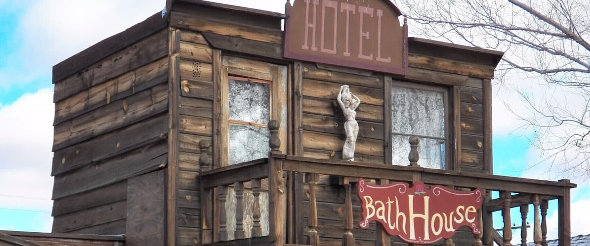 Pioneertown is located in Southern California near Joshua Tree National Park. While the "town" itself has been used as a set for TV shows and movies there are a small number of people living in the area around these buildings.
So, what you see in this picture is not and was not an actual hotel or bathhouse except on the screen. It is more fun to walk through this place than most movie studios in Los Angeles. #architecture