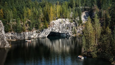 The marble quarry "Ruskeala" filled with groundwater. Nature of Karelia. Summer in the northern forests.