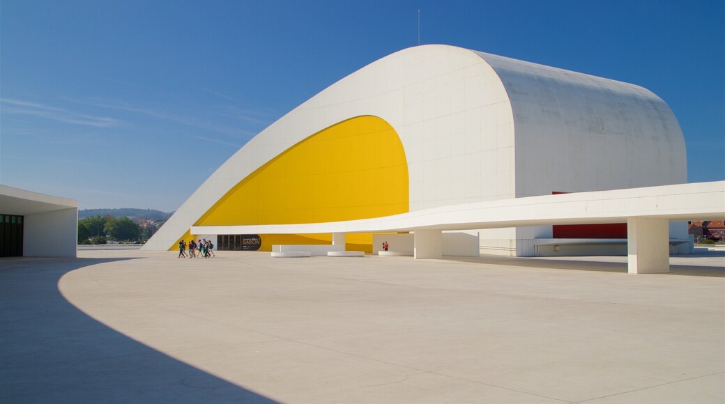 Oscar Niemeyer Cultural Centre showing modern architecture as well as a small group of people