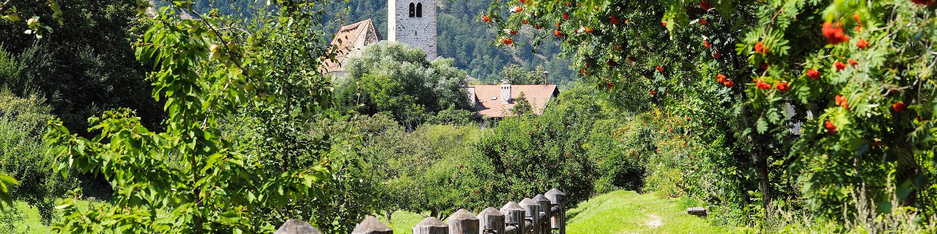 Riverside path to church of San Pancrazio beside the Mediaeval walled town of Stadt Glurns, Glorenza. Val Venosta, Italian Alps