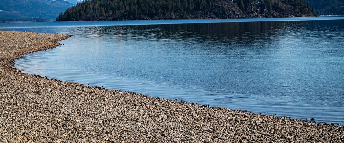 A photo of Copper Island taken from the North Shore of Shuswap Lake in British Columbia, Canada. The area is popular for kayaking and hiking.