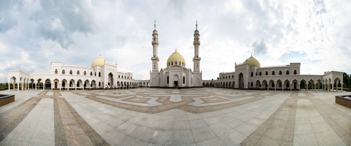 A large mosque with two minarets and a central dome.