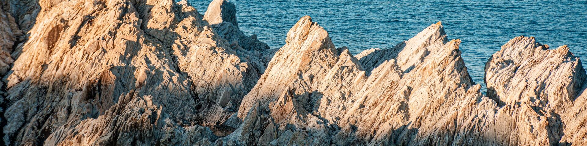 This is "Jodogahama", a scenic spot in Miyako City, Iwate Prefecture, Japan. Beautiful white rock formations at sunset