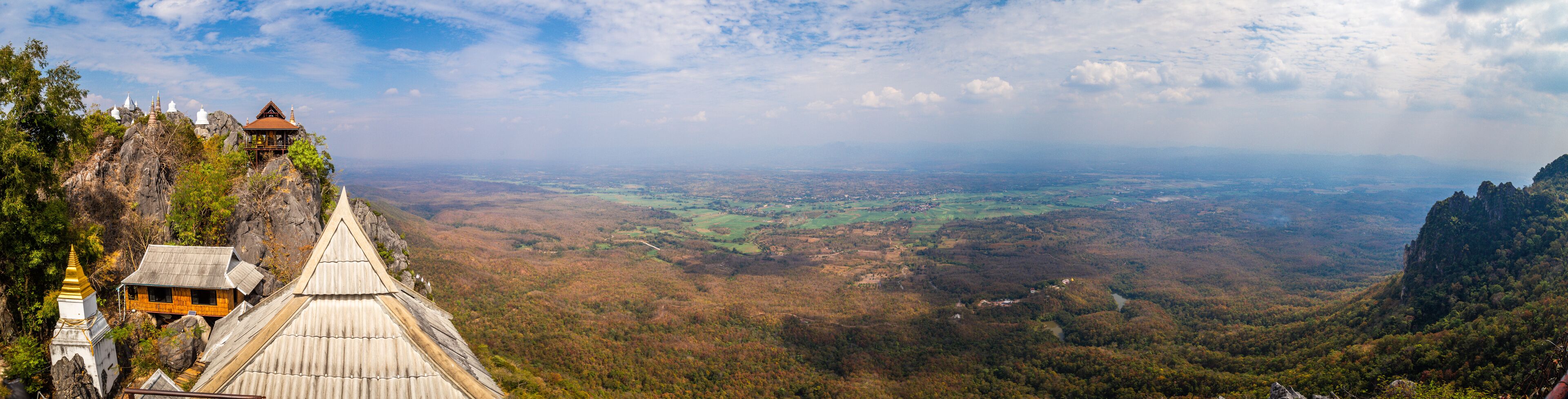 Aerial view of Wat Chaloem Phra Kiat Phrachomklao Rachanusorn, sky pagodas on top of mountain in Lampang Thailand