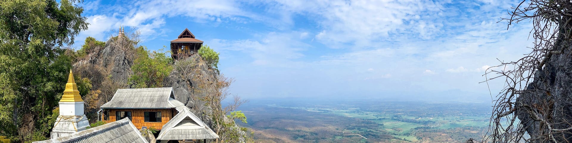 Aerial view of Wat Chaloem Phra Kiat Phrachomklao Rachanusorn, sky pagodas on top of mountain in Lampang Thailand